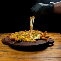 Papas fritas con cheddar