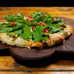 Pizza rúcula y cherry